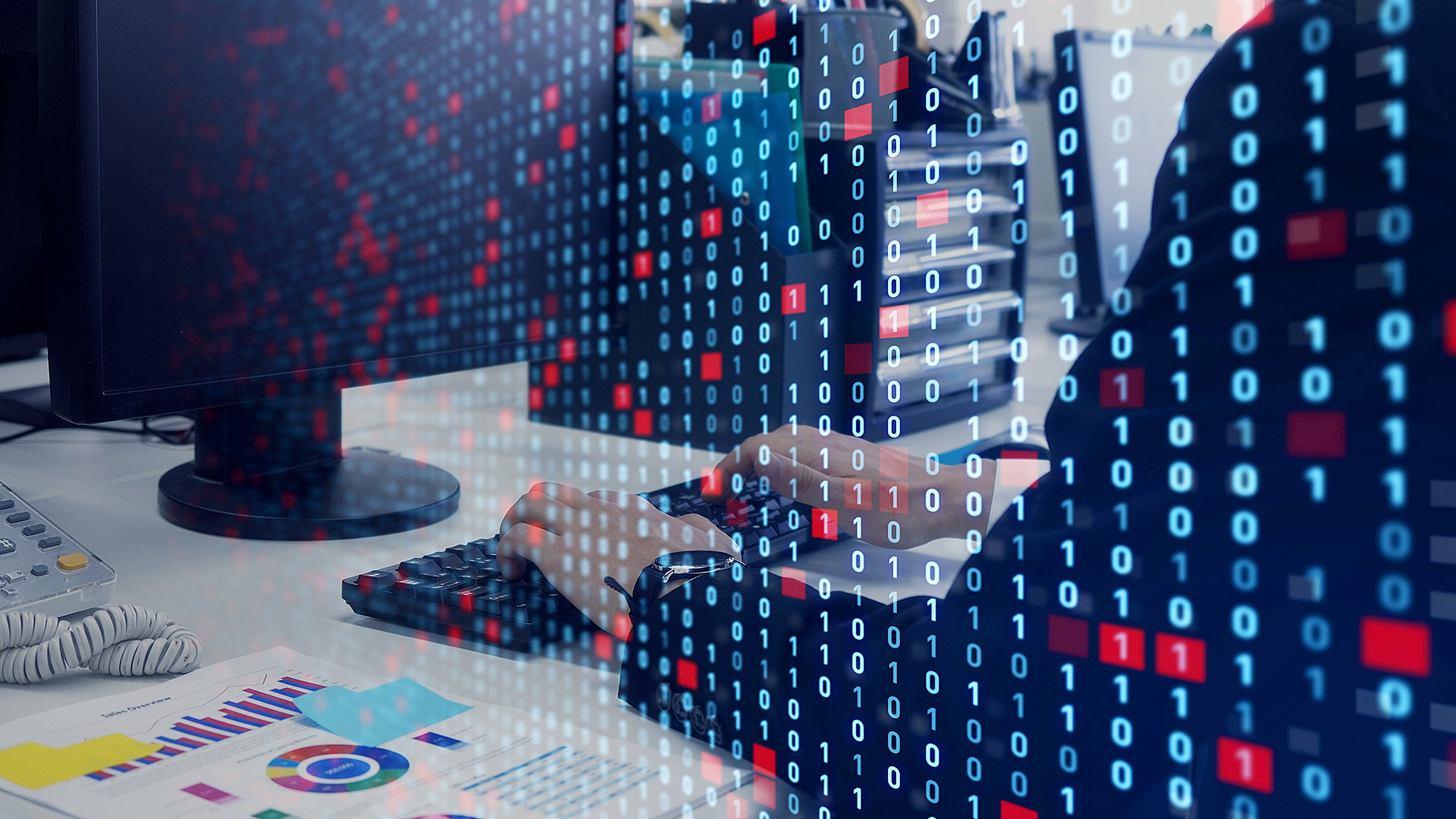 Numbers superimposed over a person typing hands on keyboard in front of computer.